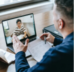 man looking in laptop