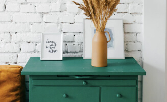 table, picture, and vase on a table